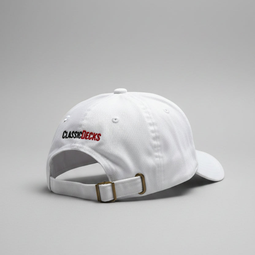 White cap with 'ClassicDecks' logo on a gray surface