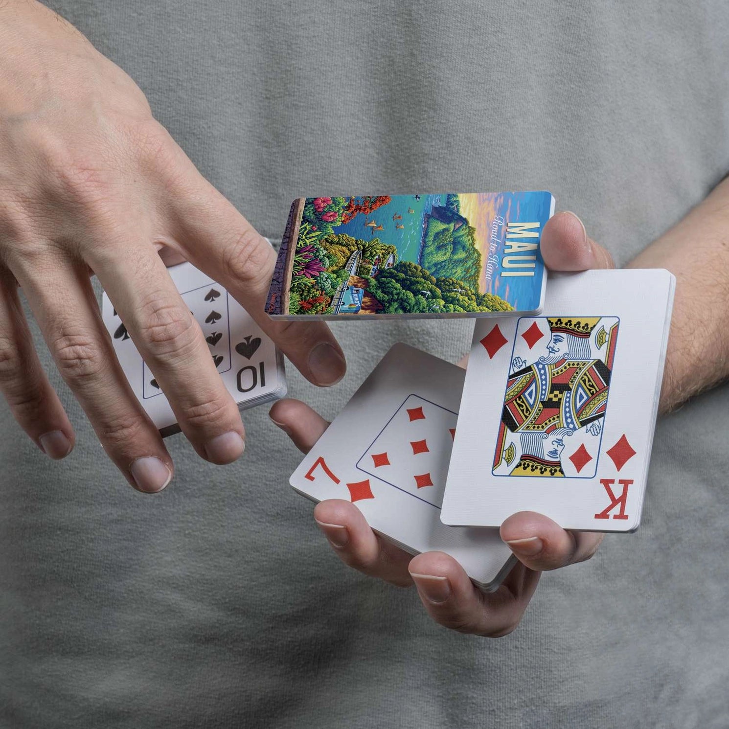 Maui Road to Hana jumbo-index playing cards in use at a table with colorful Maui scenic card backs