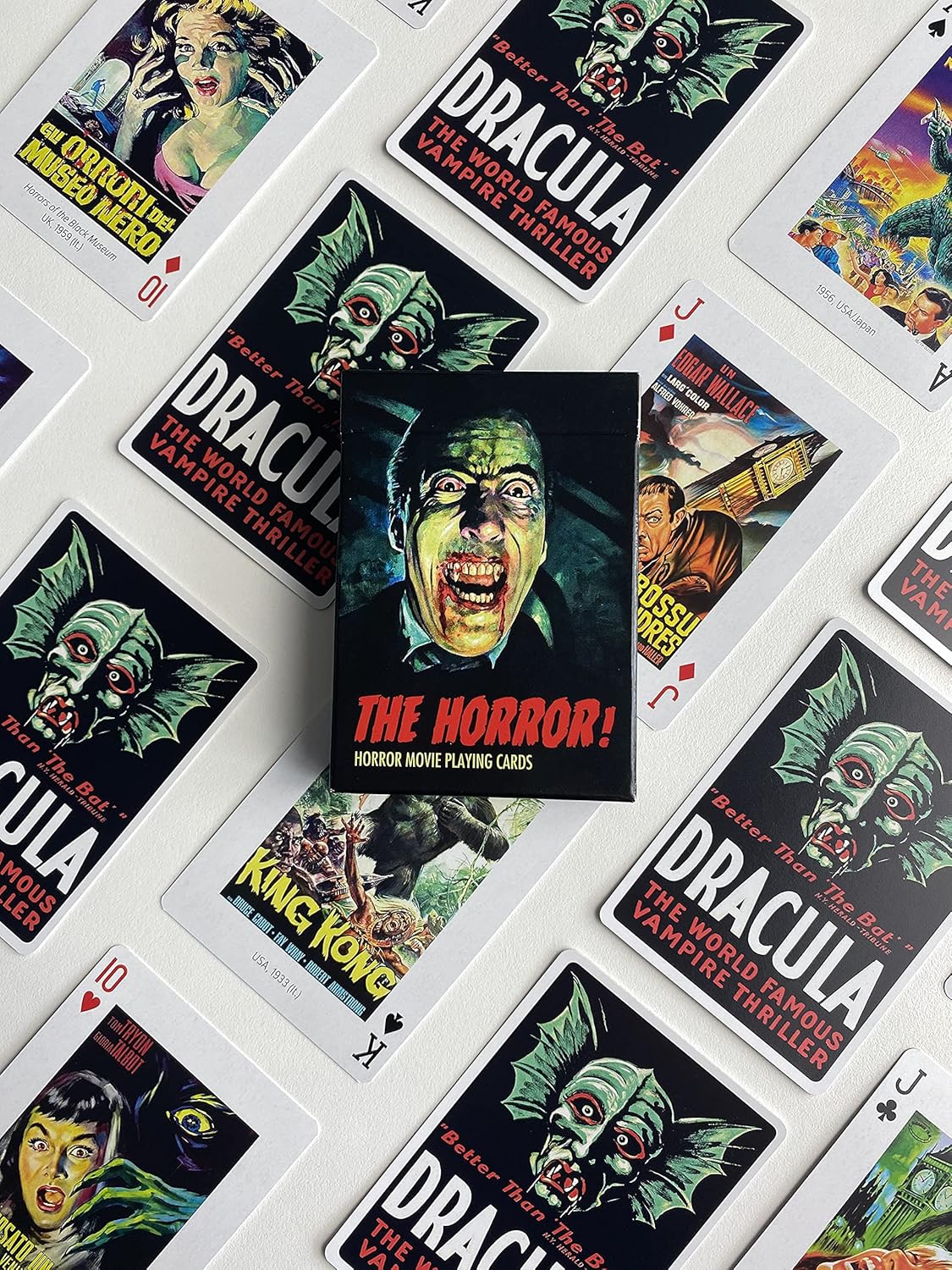 Piatnik The Horror! playing cards spread out, showing vintage horror movie poster faces and Dracula‑themed card backs around the tuck box.