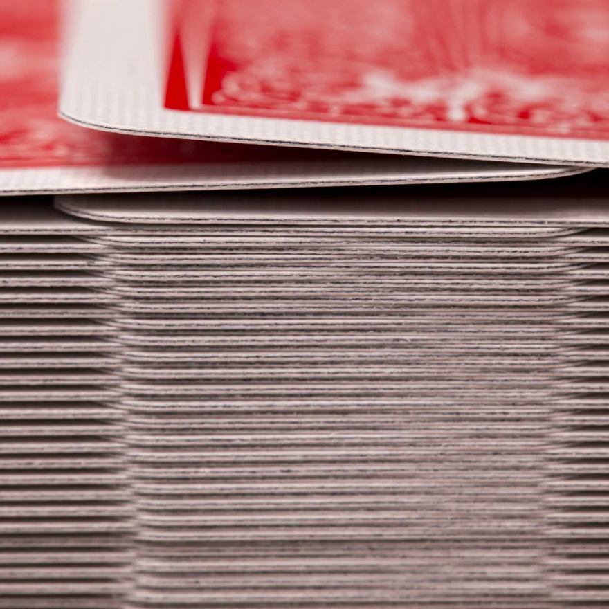 Stack of white cards with red text on a white background