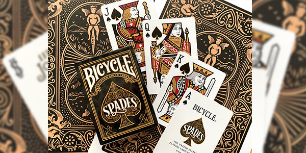 Bicycle Spades playing cards with intricate designs and card faces.