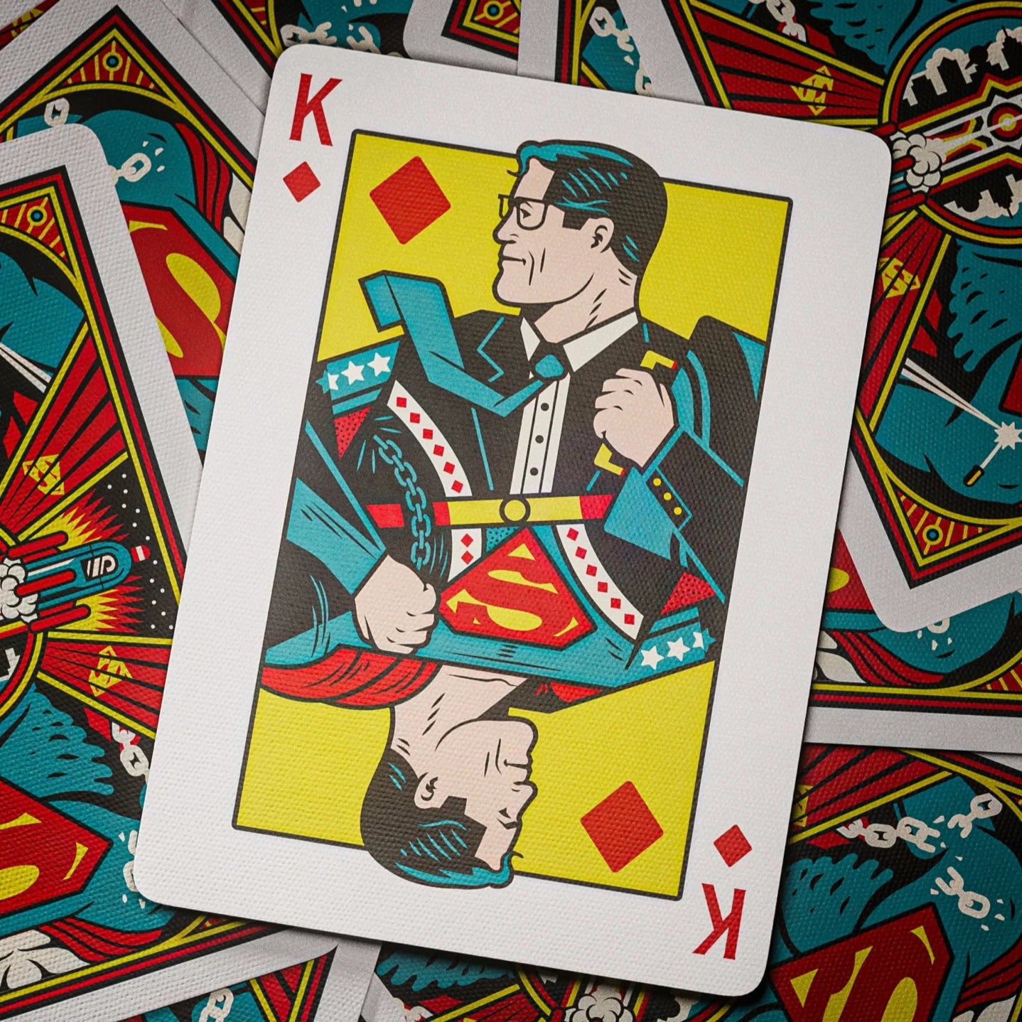 Superman playing card with colorful border on a deck of cards