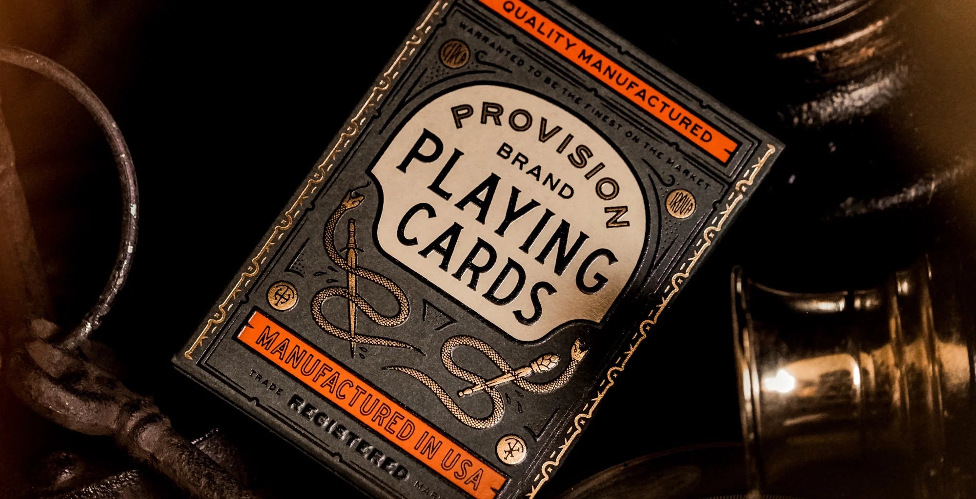 Provision Brand playing cards with a vintage design on a dark background