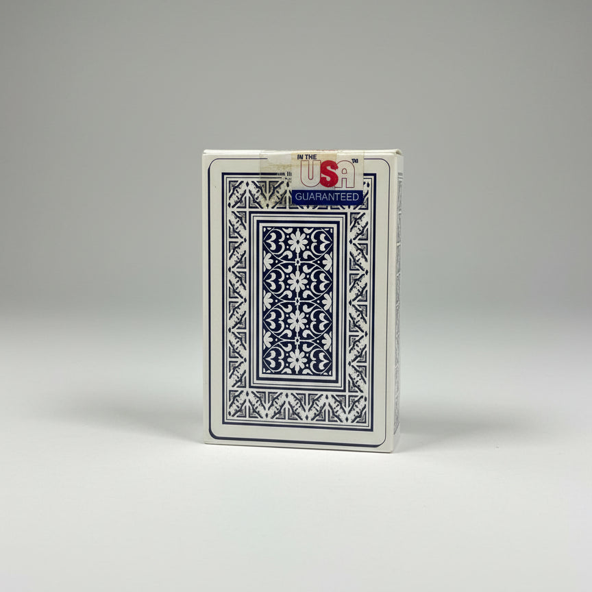 Playing card with decorative design and 'Guaranteed' label on a white background