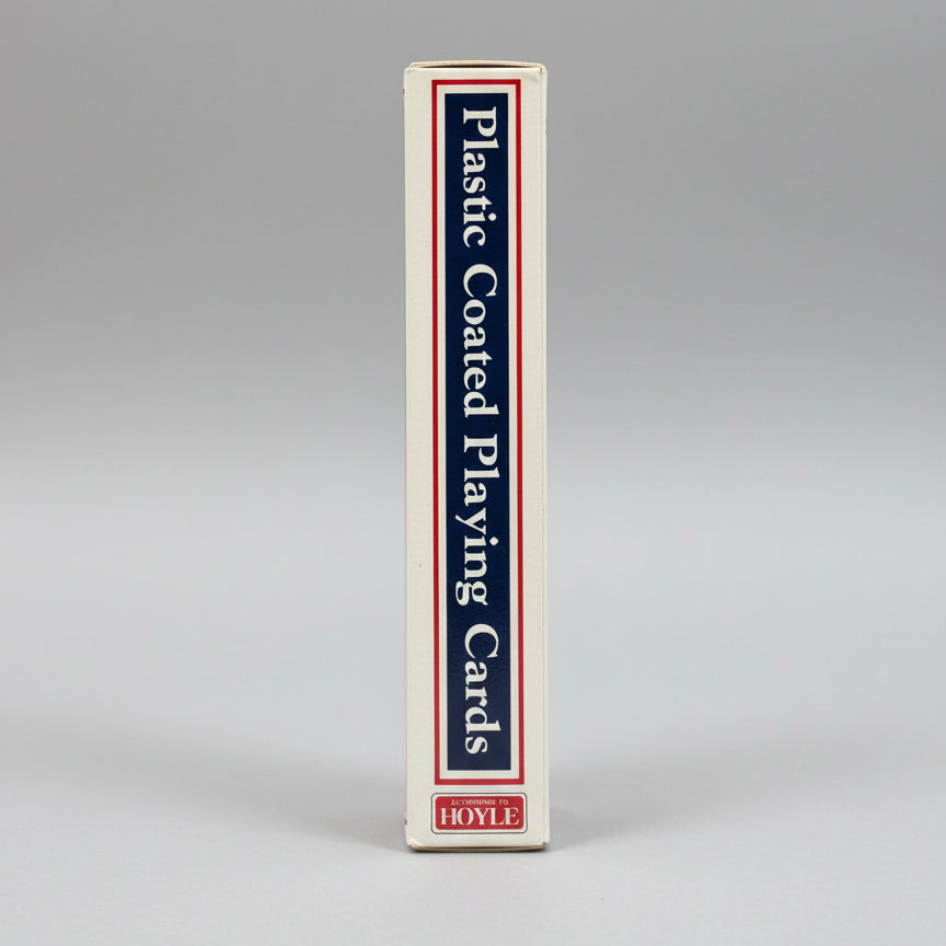 Pack of plastic-coated playing cards with Hoyle branding on a blue background