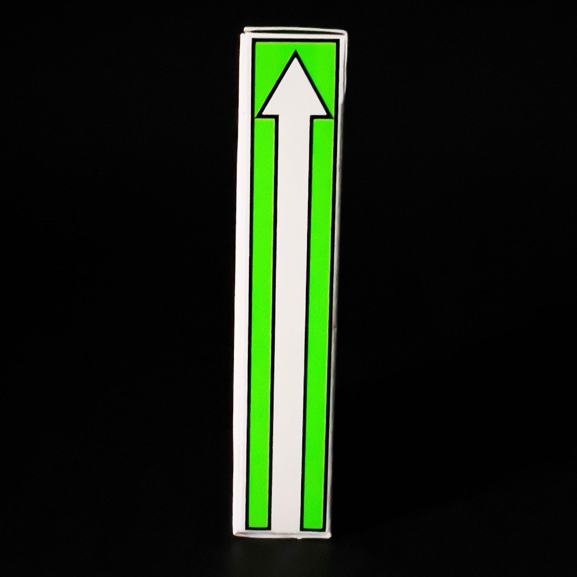 Descendents Playing Cards with a white arrow on a green background against a black background