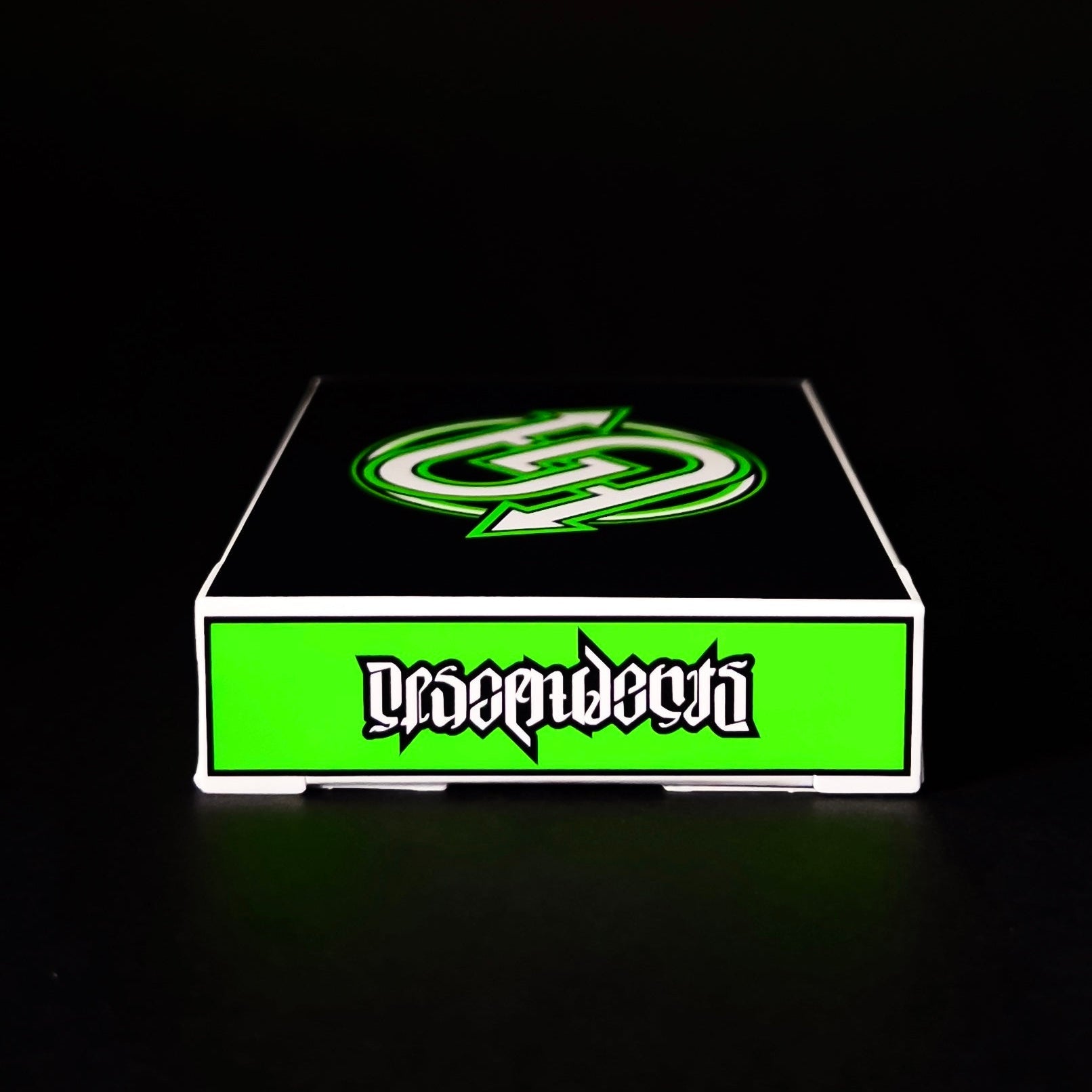 Green and white Descendents Playing Cards box with a logo on a black background