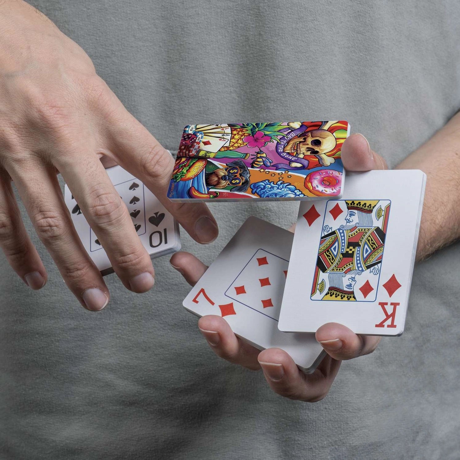 Bad to the Bone skull-and-dog card back displayed during a flourish with traditional playing-card faces