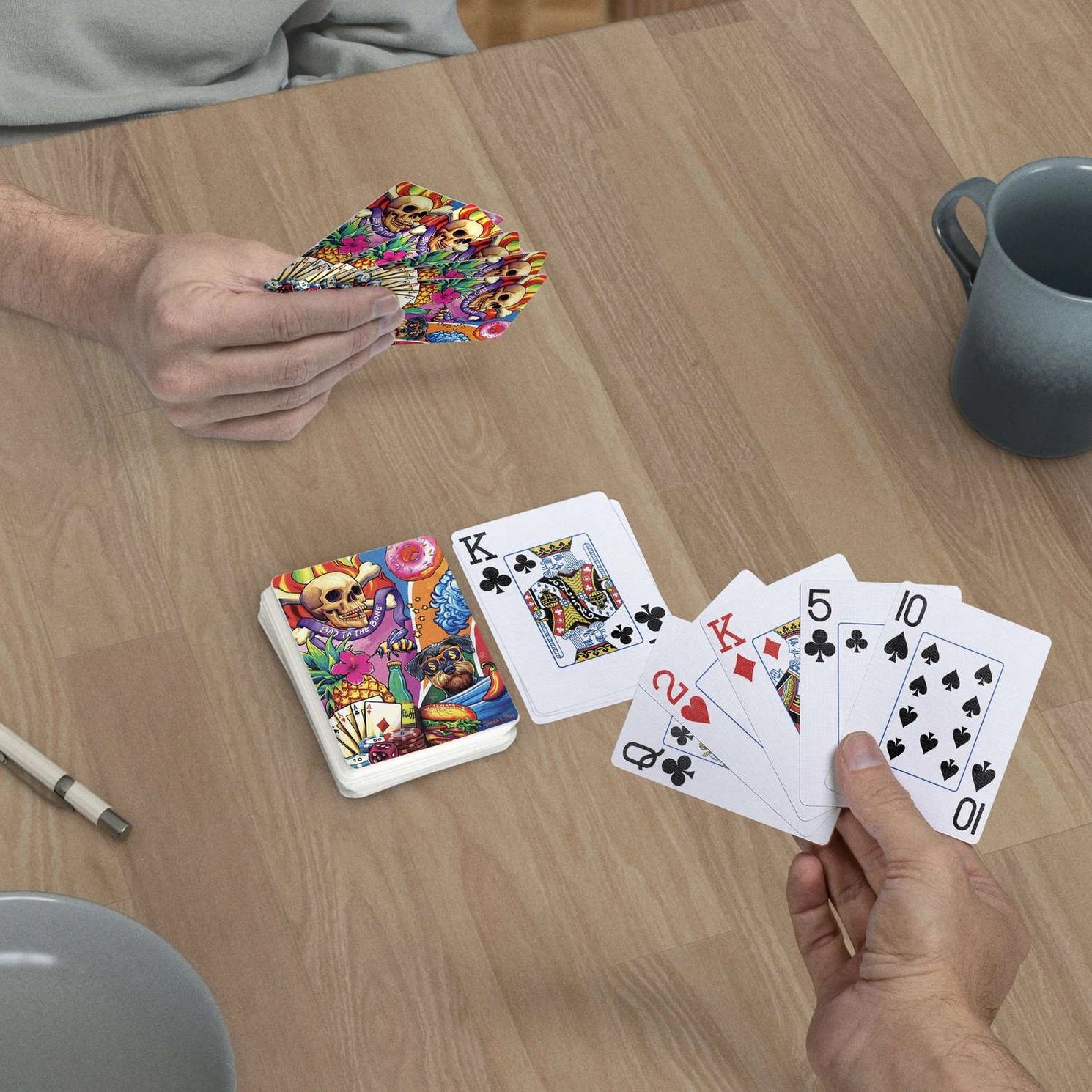 Bad to the Bone jumbo-index playing cards in use at a table with colorful pop-art card backs