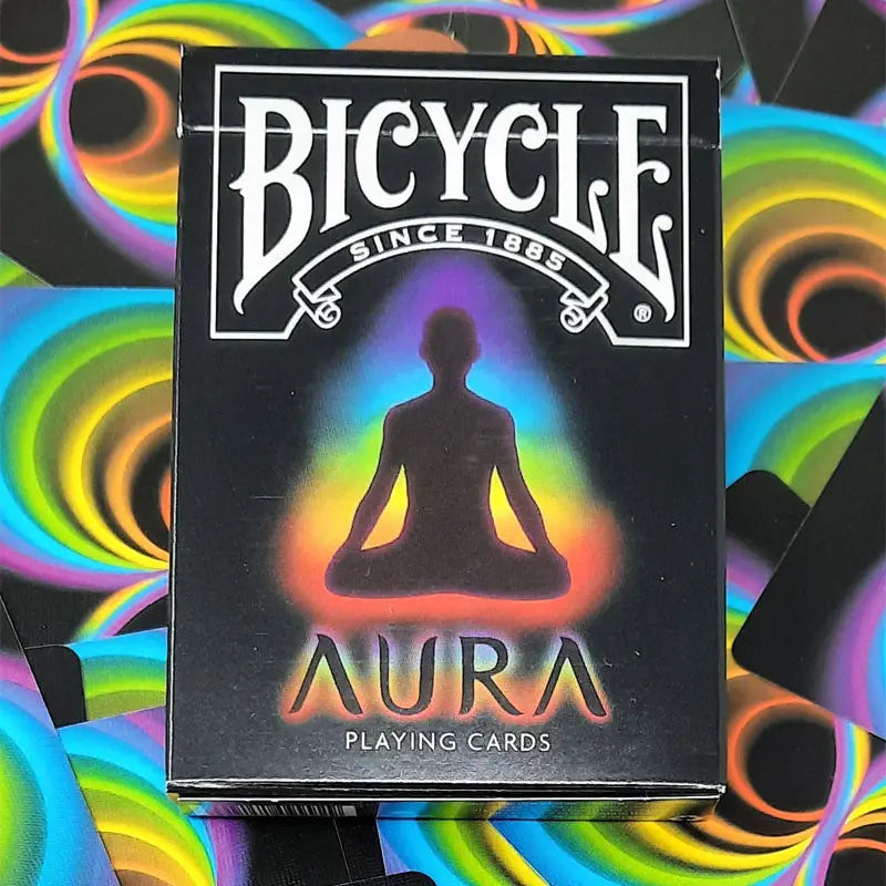 Bicycle Aura tuck box showing a meditating silhouette surrounded by rainbow swirl card backs.
