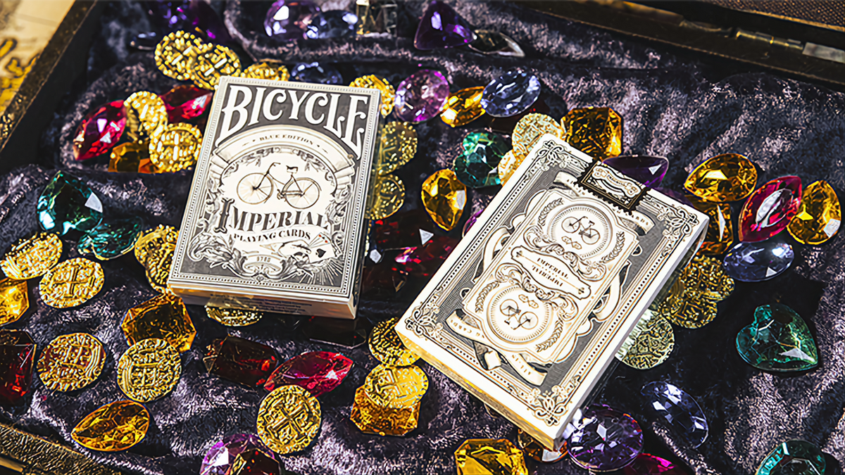 Bicycle Imperial Blue Edition tuck box and custom card back displayed among gems