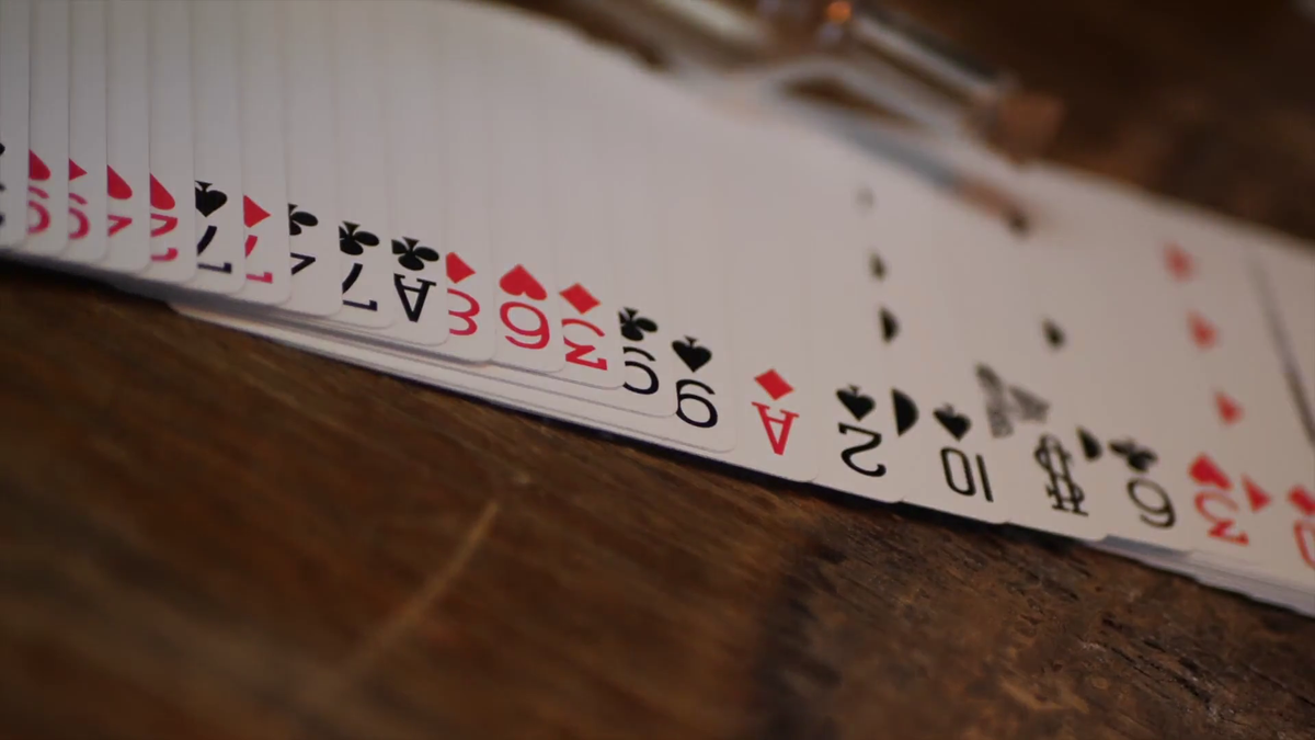Bicycle Metallic Emerald playing card faces and standard red and black suits displayed in a spread
