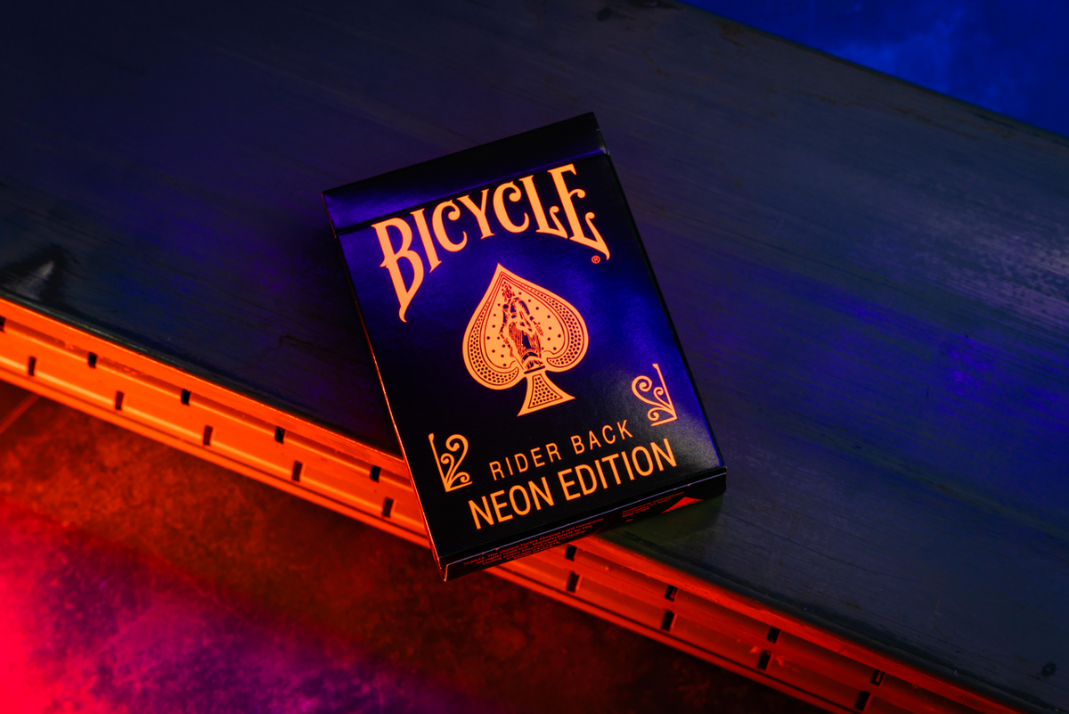 Bicycle Neon Solar-Orange orange tuck box under UV blacklight