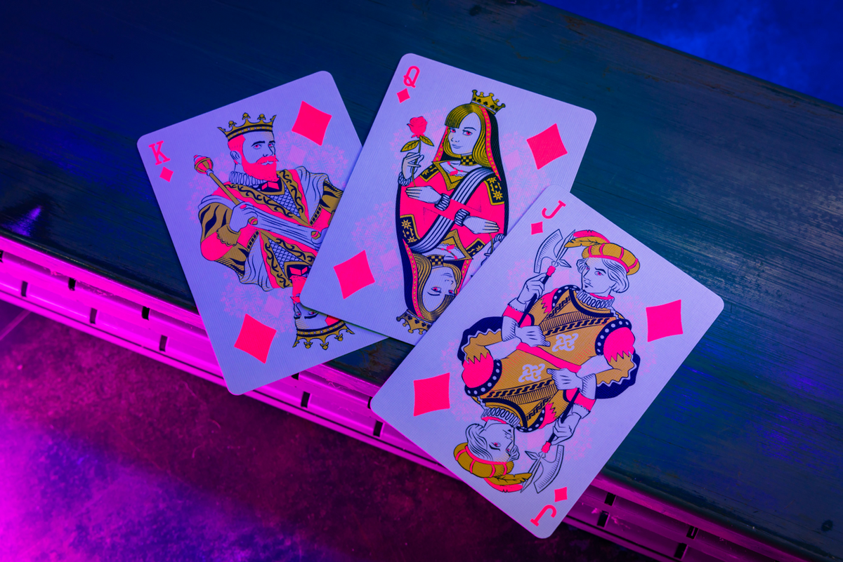 Bicycle Neon Star-Fire Pink custom diamond court cards under UV blacklight
