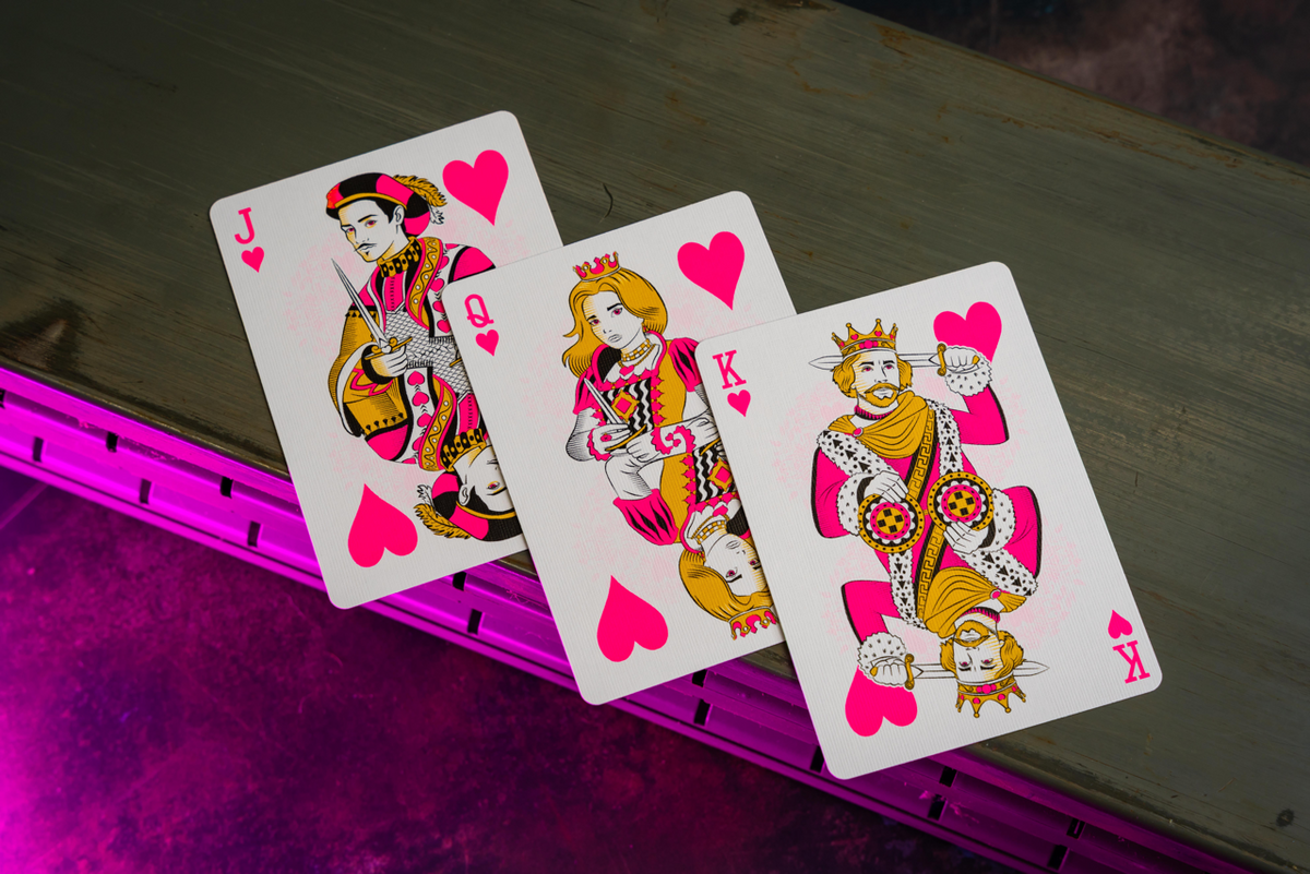 Bicycle Neon Star-Fire Pink custom heart court cards in ambient light