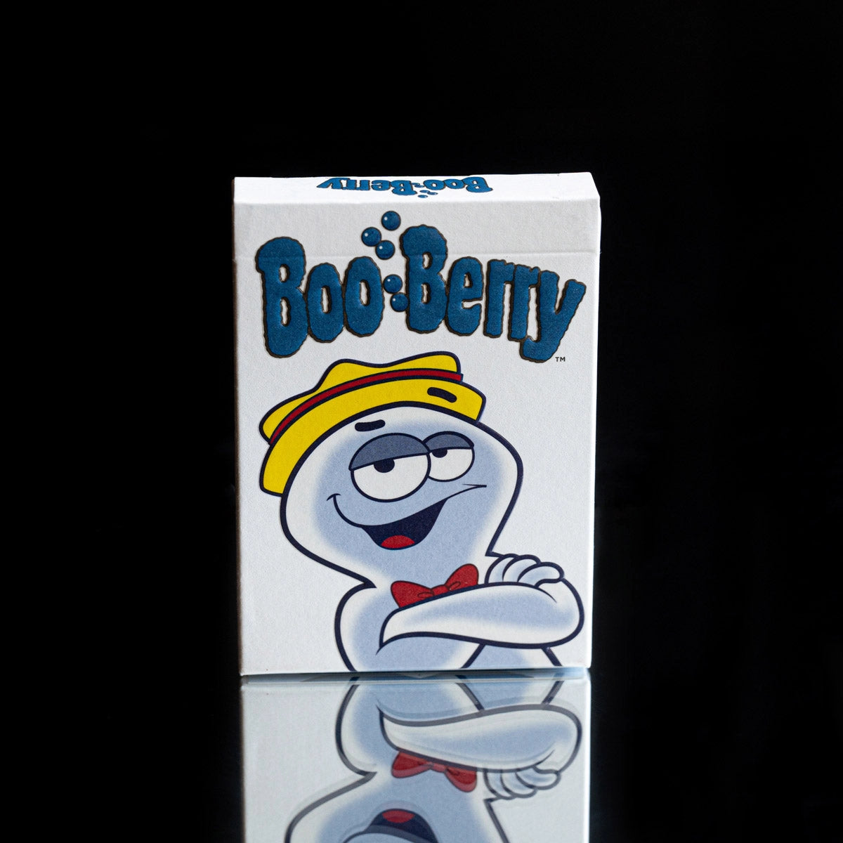 Front of the Boo Berry playing cards tuck box with blue lettering and the ghost wearing a yellow hat and red bow tie.