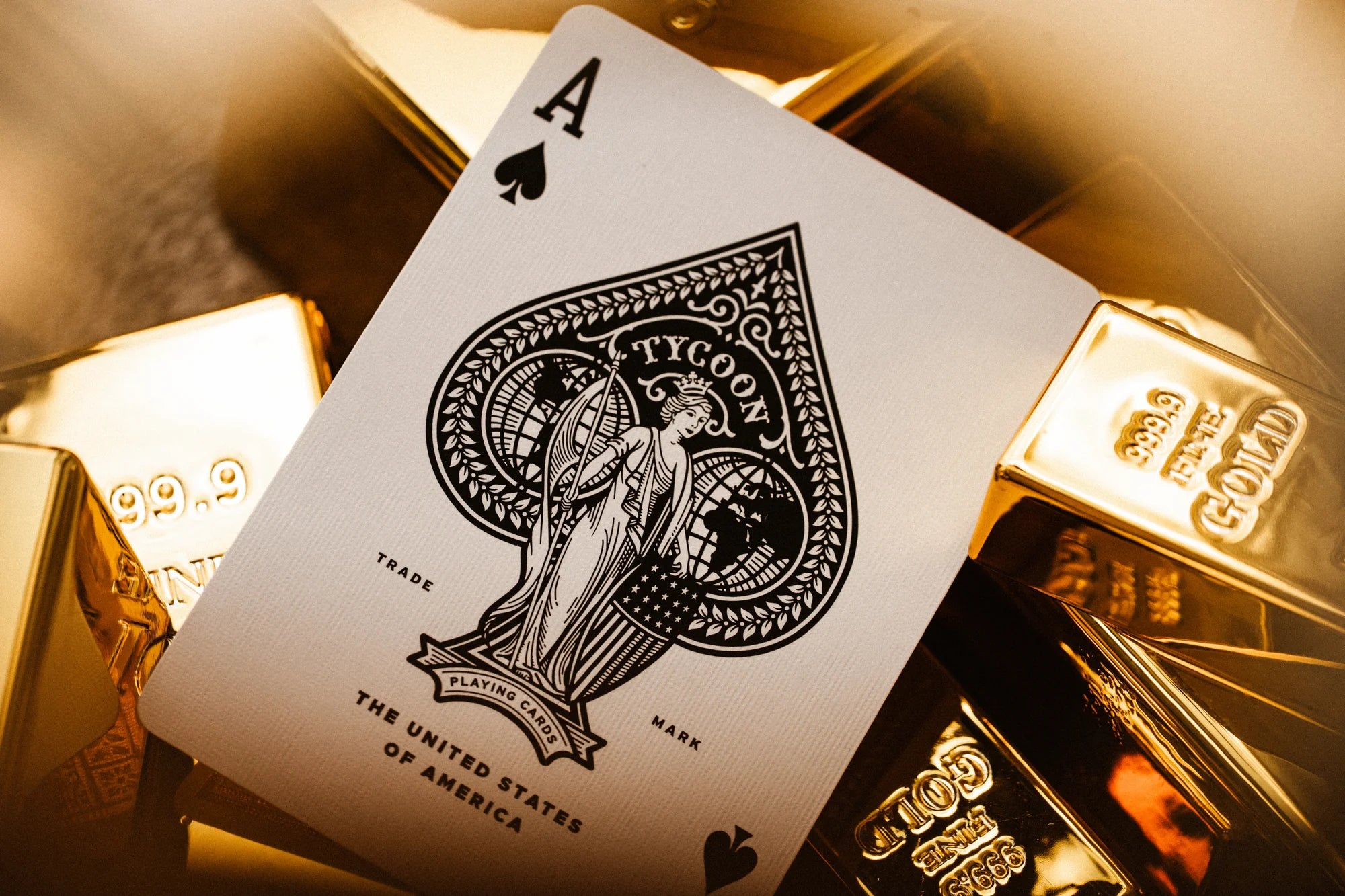 Ace of spades from Tycoon 25th Anniversary deck showing Tycoon Lady inside custom spade on gold bars background.