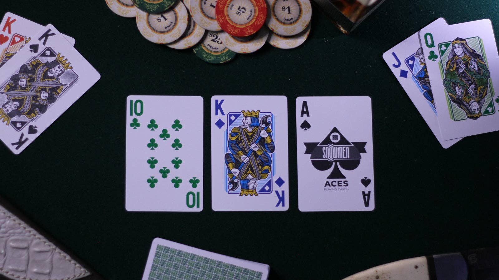 Vanda Aces 2.0 Playing cards and poker chips on a black table