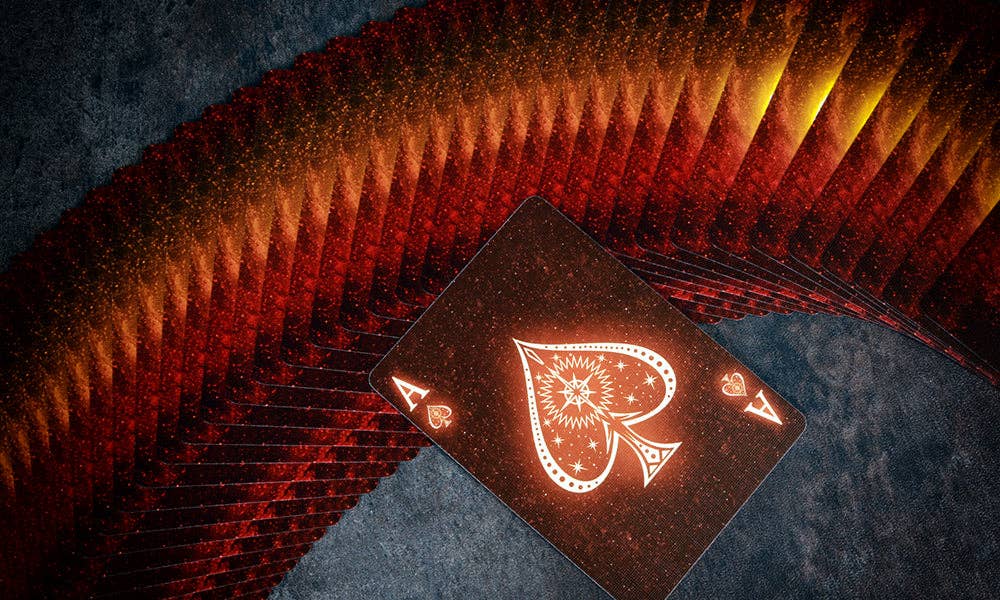 Playing card with a spade symbol on a textured surface