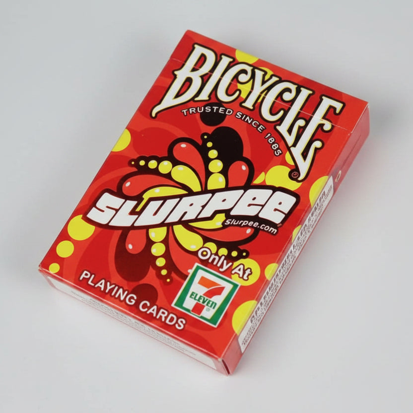 Red Bicycle Slurpee playing card deck on a dark textured surface