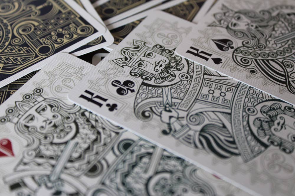 Close-up of playing cards with intricate designs and symbols.