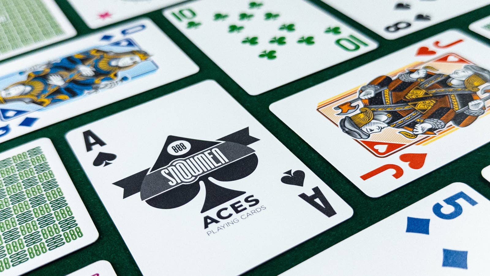 Close-up of playing cards with a focus on the Aces brand logo.