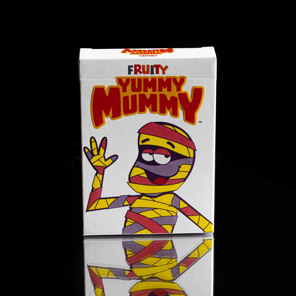 Front of the Fruity Yummy Mummy playing cards tuck box with cereal lettering and illustrated mummy.