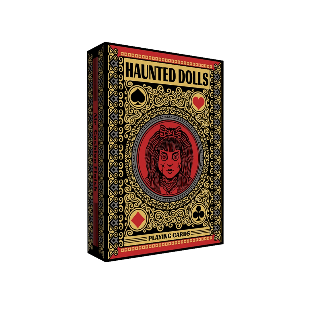 Haunted Dolls Playing Cards tuck box with a red doll portrait, suit symbols, and ornate gold-colored artwork