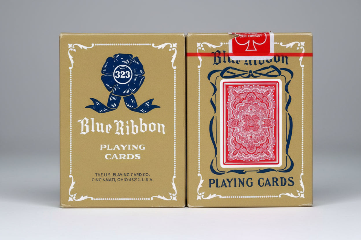 Blue Ribbon playing cards packaging with card design on gold background