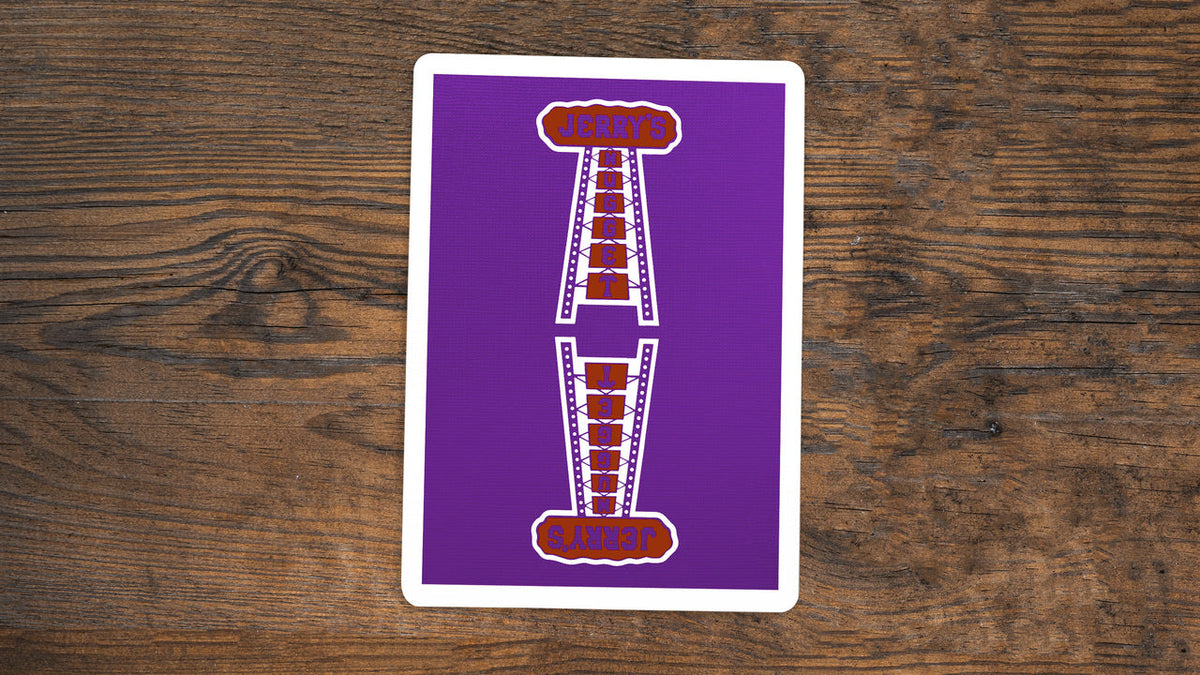 Royal purple Jerry’s Nugget playing card back with the red and white casino sign and white border.