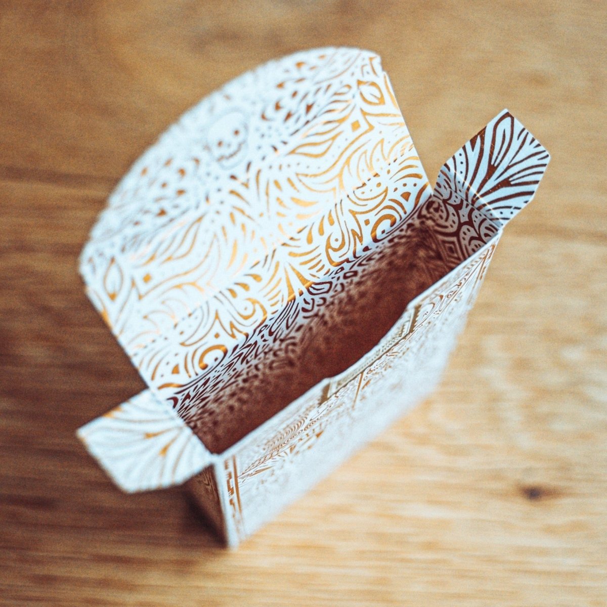 Joker and the Thief White Gold tuck box open to show its printed interior