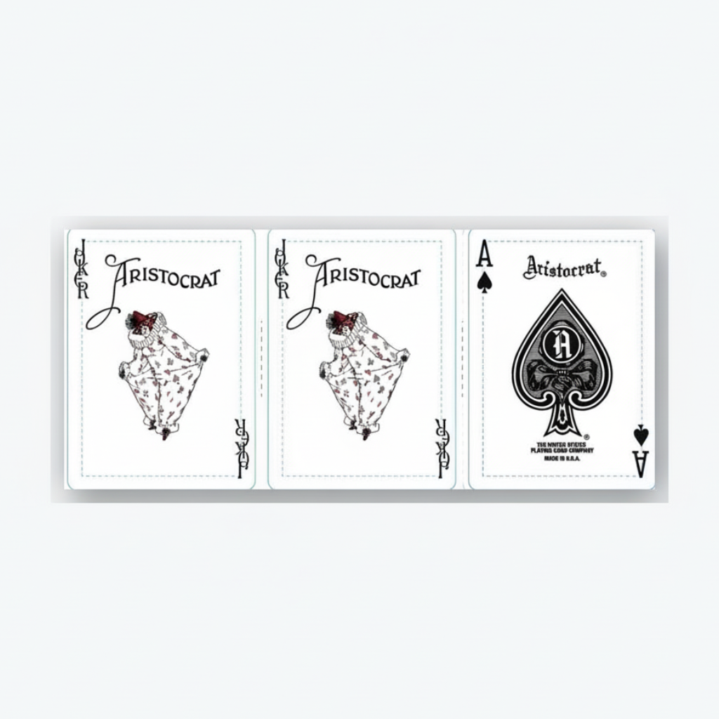 Three playing cards from the Aristocrat 727 110th Anniversary deck on a white background including Vintage Aristocrat Ace of Spades with Russell Playing Card Company maker line and date code