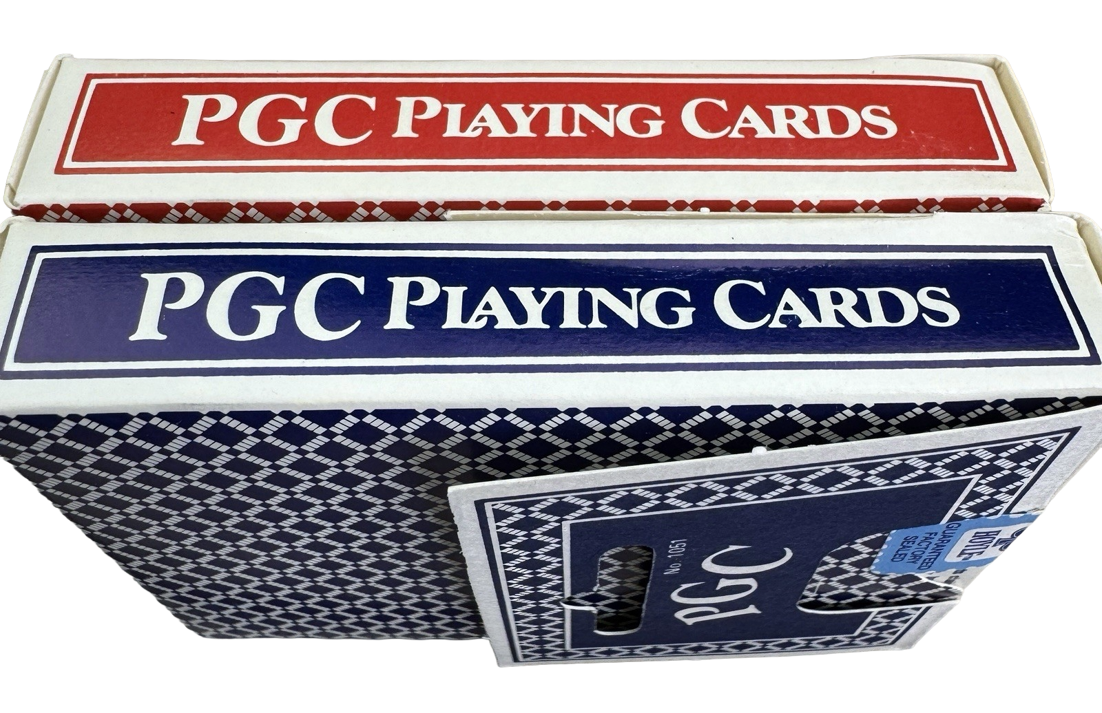 Two boxes of PGC Playing Cards, one red and one blue, on a white background.