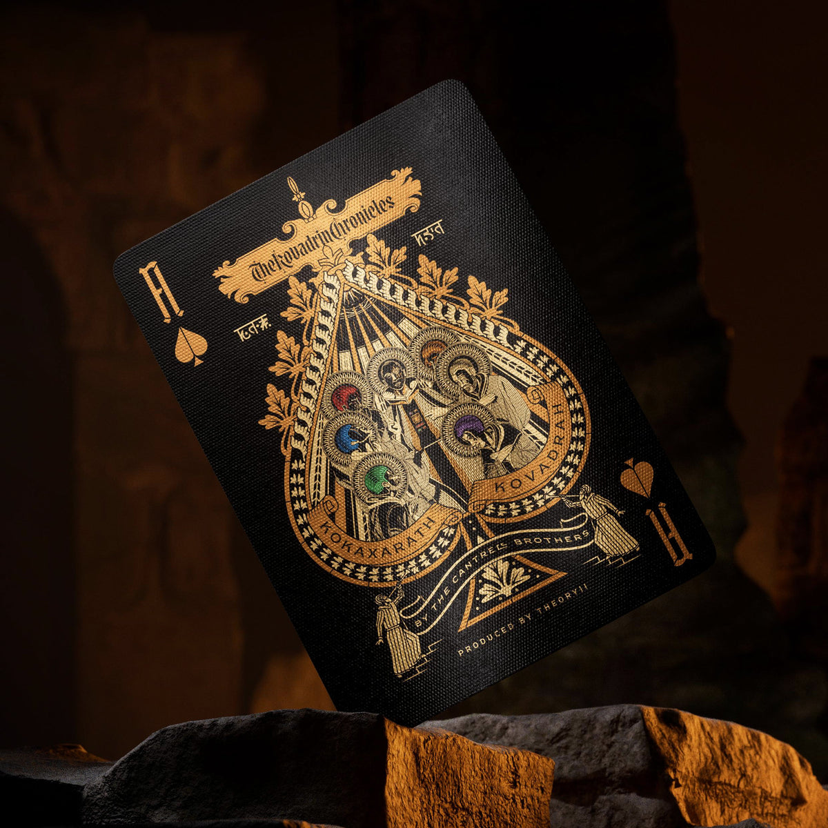 Theory11 Kovadrin Ace of Spades with an ornate central illustration, multicolor foil details, and custom gold-colored indices.