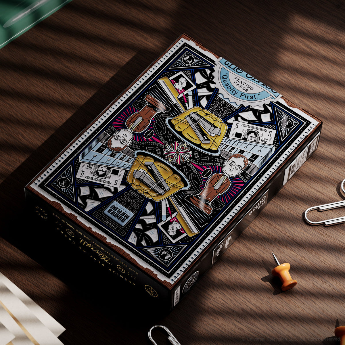 Angled view of The Office Playing Cards tuck box showing its illustrated rear panel