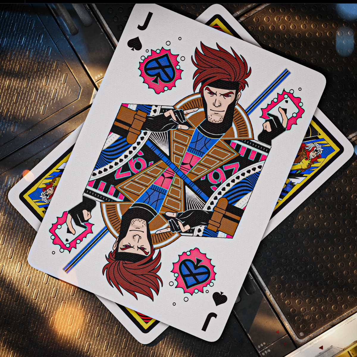 Gambit as the Jack of Spades in theory11 X-Men Playing Cards, holding a charged card beside his staff.