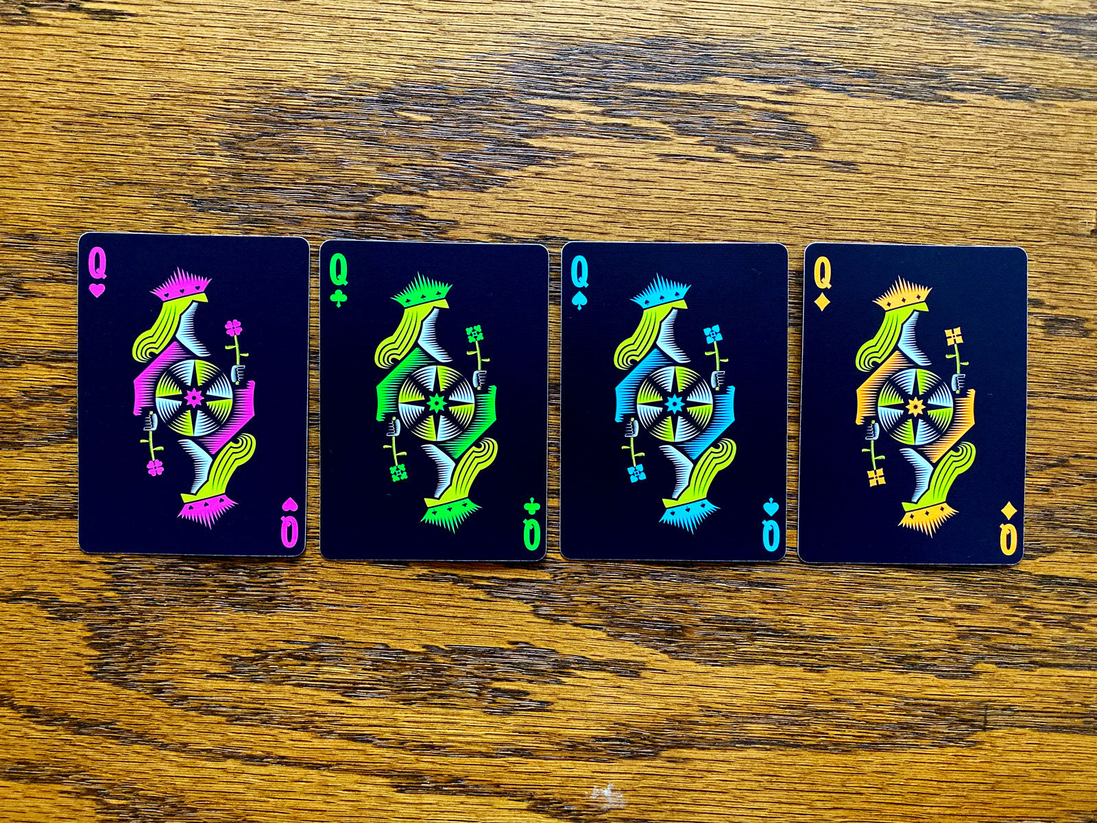 Four custom Queens from Polaris Winter Solstice showing the pink, green, cyan and orange suit colors