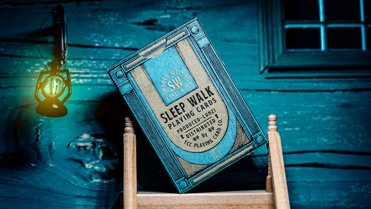 Sleep Walk Playing Cards blue tuck box displayed in a dreamlike bedroom setting