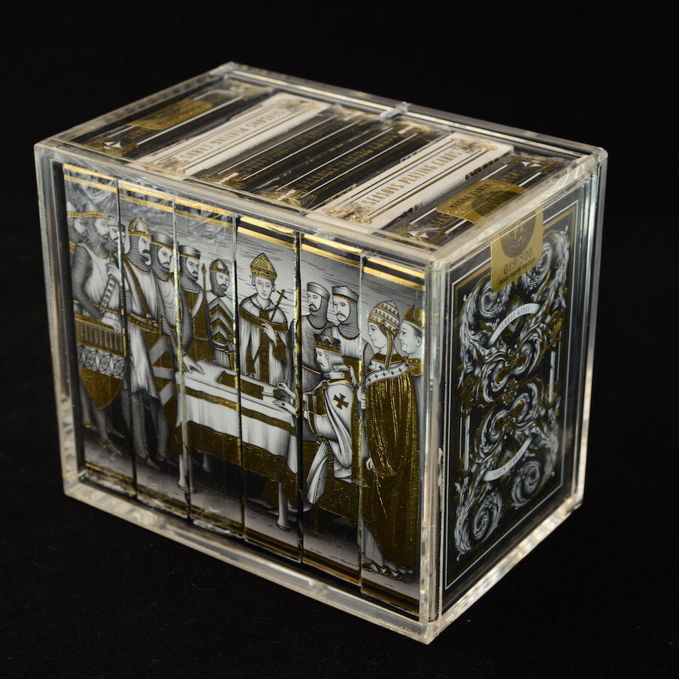 Carat X6 Half Brick Case displaying six coordinated collector playing card decks at an angle