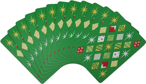 Set of playing cards with decorative designs on a green background