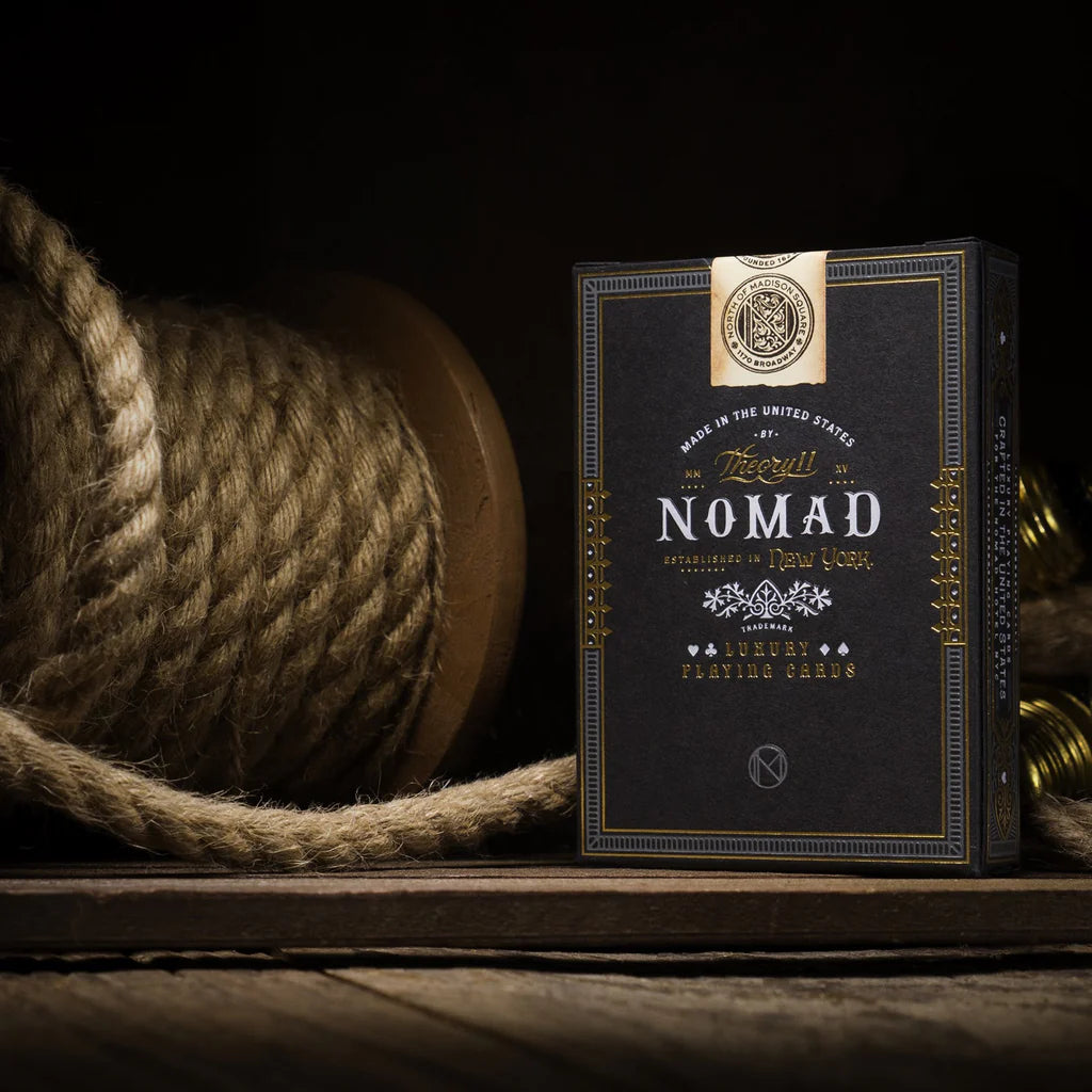 Firedoor Nomad playing cards with rope and gold accents on a dark background