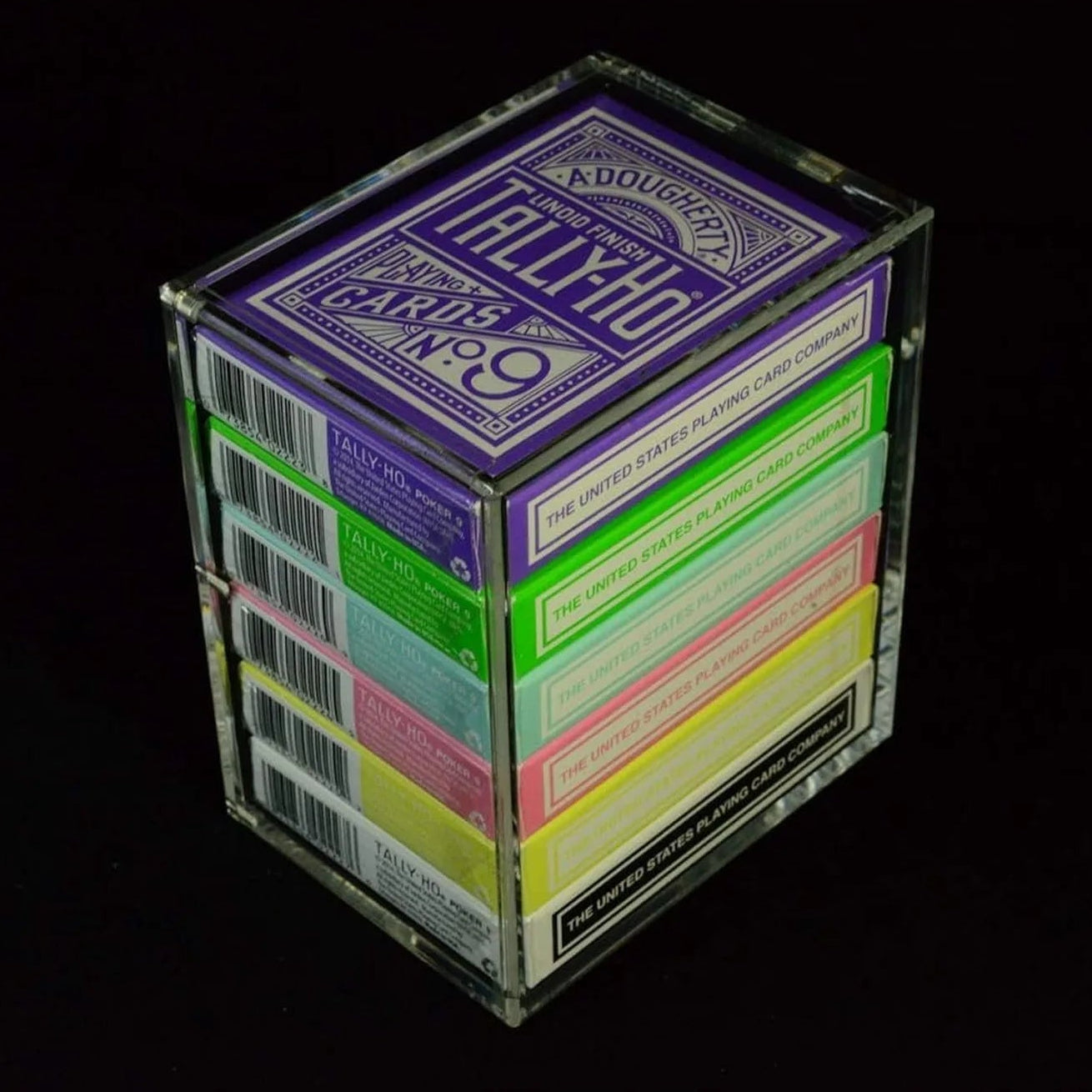 Angled view of Carat X6 acrylic case with six Tally-Ho decks and visible tuck box sides