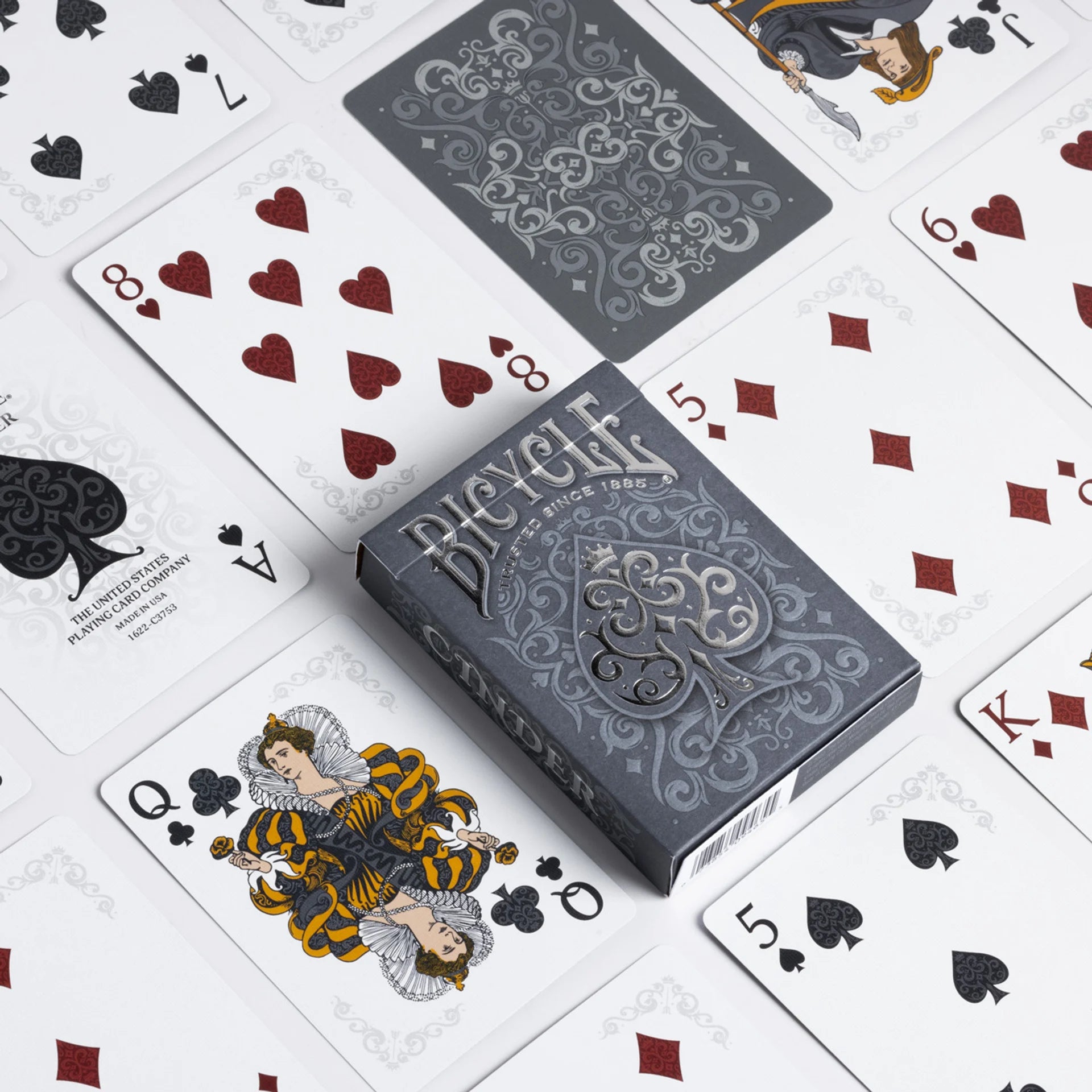 CInder playing cards with a deck labeled 'Bicycle' on a white background