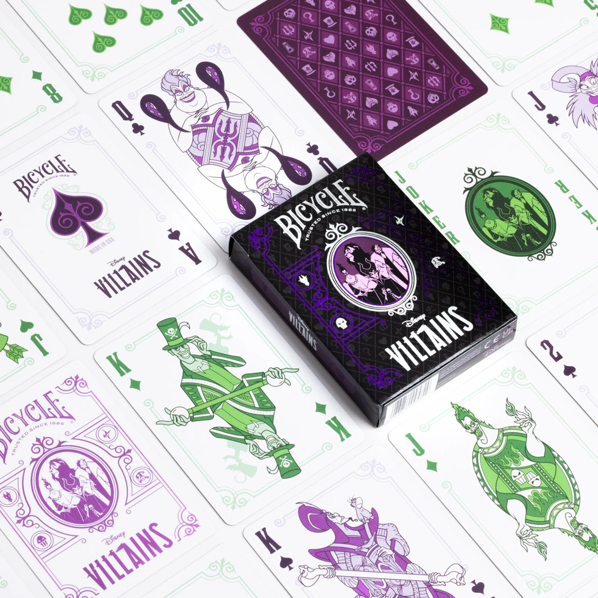 Bicycle Villains playing cards with purple and green designs on a white background