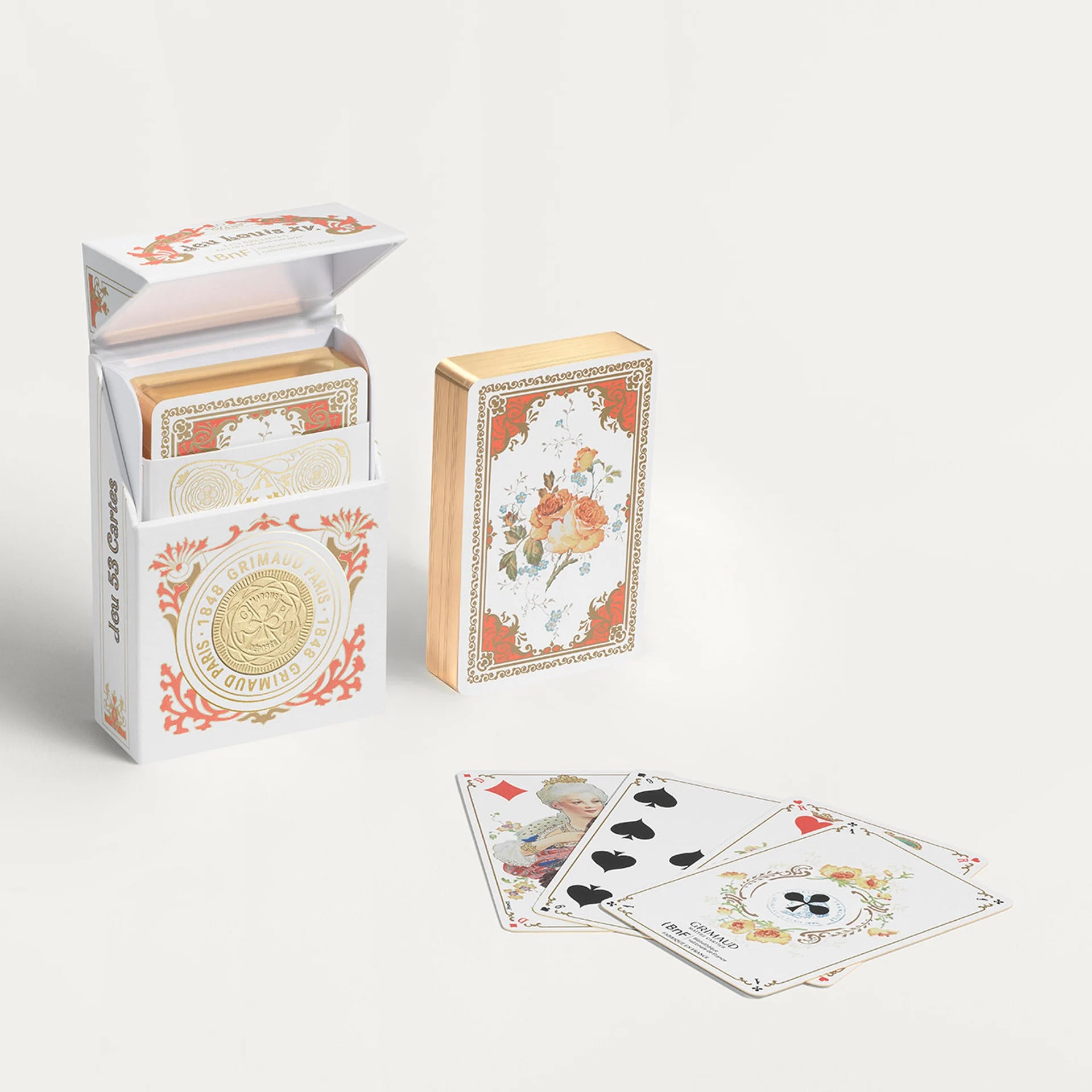 Decorative Grimaud N°1504 Jeu Louis XV playing cards with open box and cards on a white background