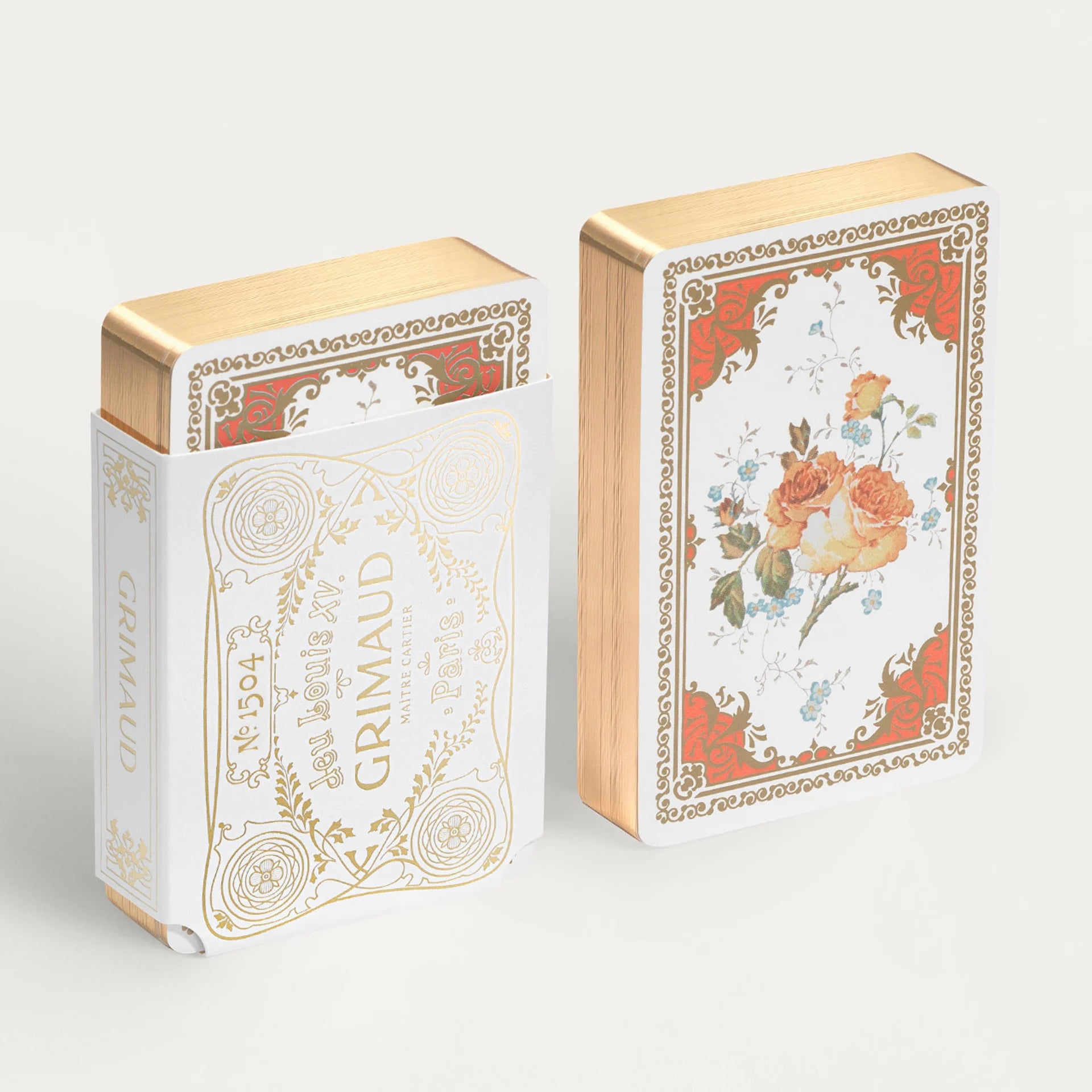 Two decorative Grimaud N°1504 Jeu Louis XV boxes with floral designs and 'Grimaud' branding on a light gray background