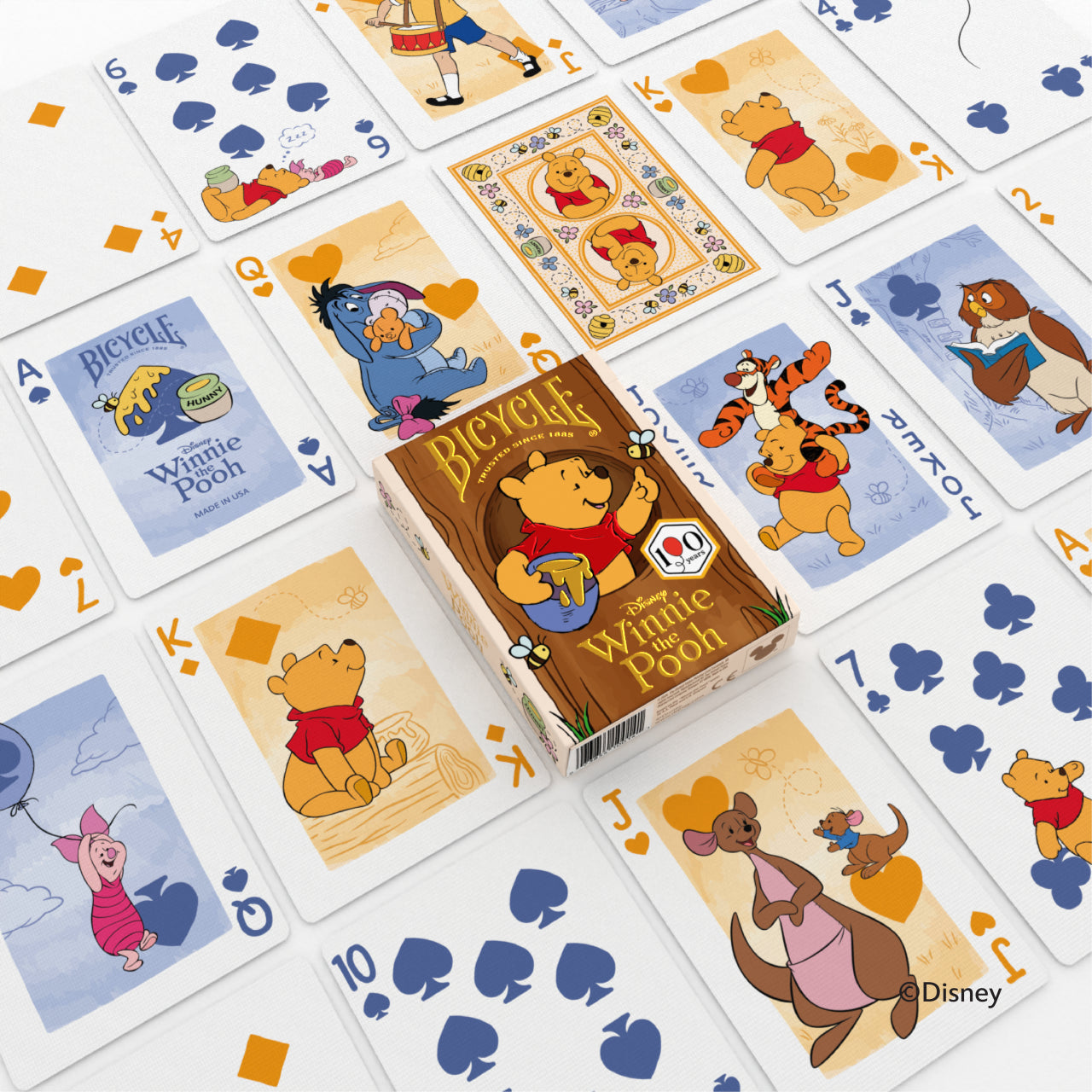 Bicycle Disney Winnie the Pooh deck spread out with Pooh, Piglet, Tigger, Eeyore, and Kanga character cards around the tuck box.