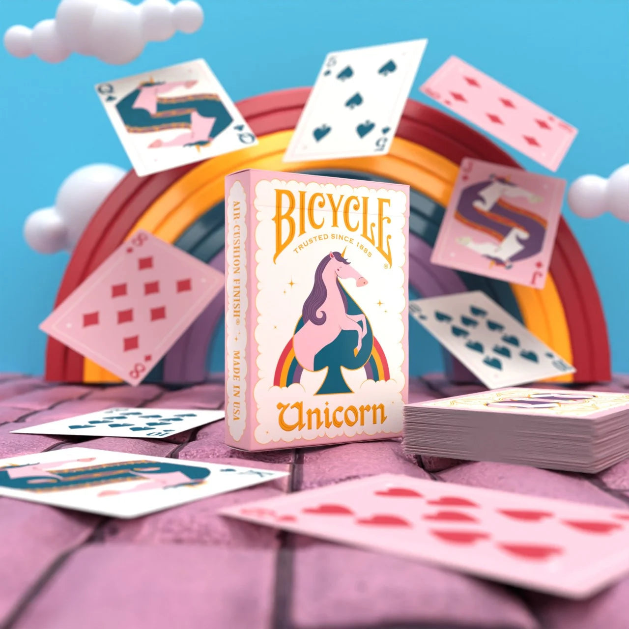 Bicycle Unicorn Pink tuck box with rainbow and floating playing cards
