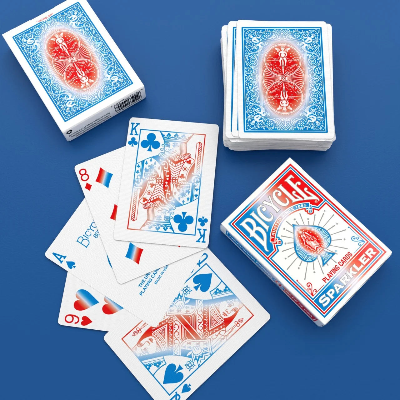Bicycle Sparkler Playing Cards with stacked deck, white tuck box, custom King and Ace of Spades, and blue red back design