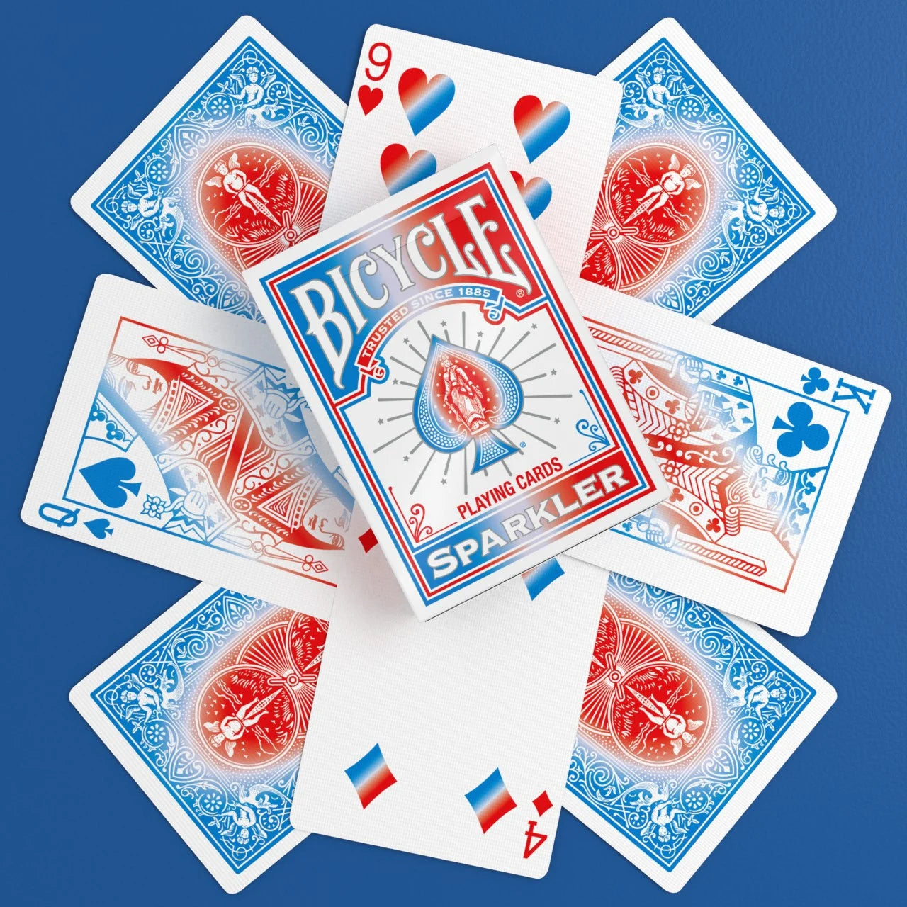 Bicycle Sparkler Playing Cards with tuck box, custom backs, gradient courts, and red blue pip cards arranged in a flat lay